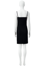 Load image into Gallery viewer, A black sleeveless mini dress with thin shoulder straps, displayed on a white mannequin from the back against a plain white background.
